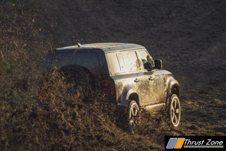 Behind the scenes image of the New Land Rover Defender featured in No Time To Die - 2