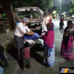 TML distributing cooked meal during dinner time