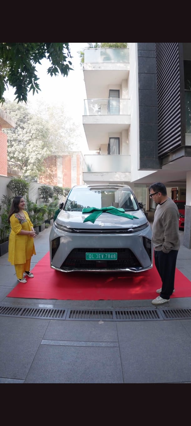 Ashneer Grover taking delivery of MG M9