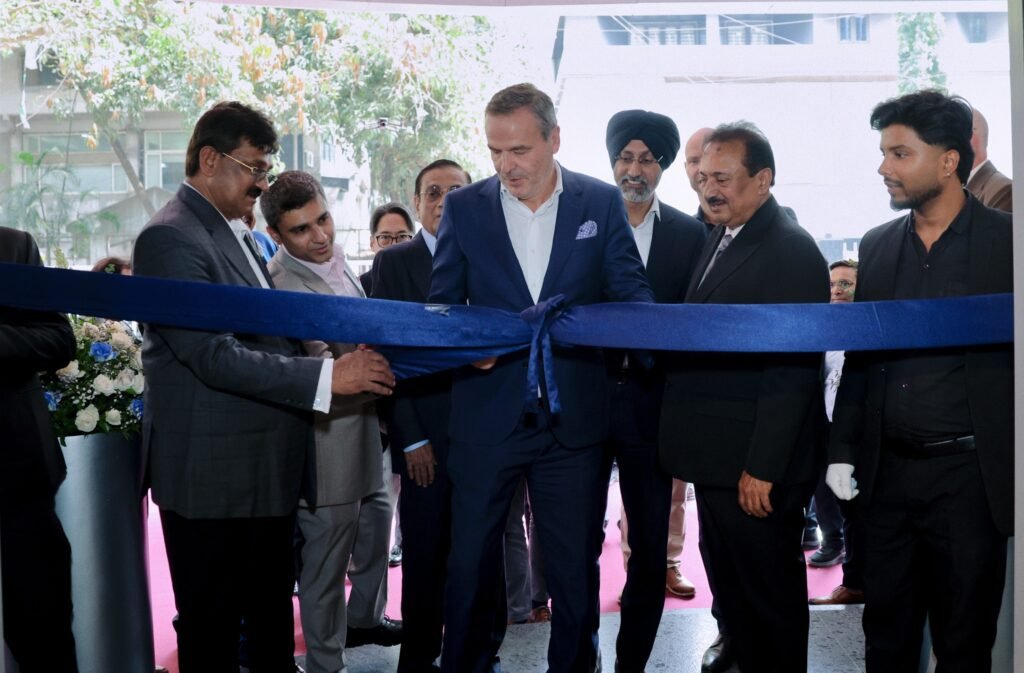 02 Image Mr. Ralf Hattler inaugurating Navnit Motors Retail.NEXT Service Workshop along with Mr. Navnit Kachalia, Mr Vijay Kachalia, Mr. Sharad Kachalia, Krishna Kachalia, Hardeep Singh Brar